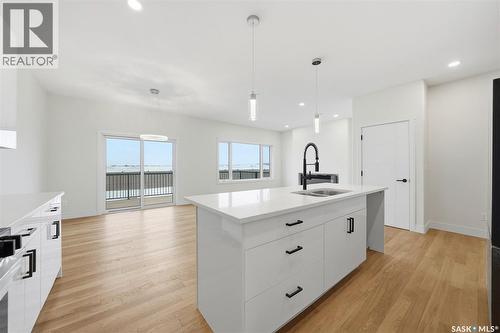 335 Sharma Crescent, Saskatoon, SK - Indoor Photo Showing Kitchen With Double Sink With Upgraded Kitchen