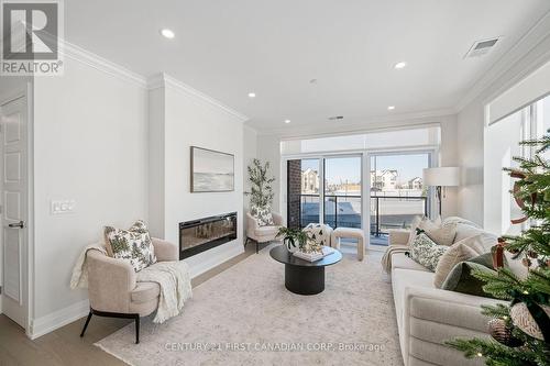 203 - 1560 Upper West Avenue, London South (South B), ON - Indoor Photo Showing Living Room With Fireplace