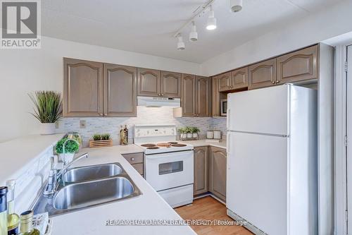 312 - 4003 Kilmer Drive, Burlington, ON - Indoor Photo Showing Kitchen With Double Sink