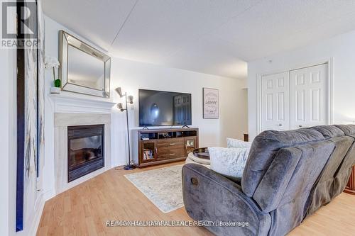 312 - 4003 Kilmer Drive, Burlington, ON - Indoor Photo Showing Living Room With Fireplace
