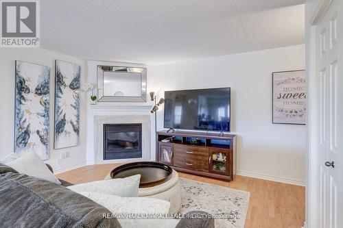 312 - 4003 Kilmer Drive, Burlington, ON - Indoor Photo Showing Living Room With Fireplace