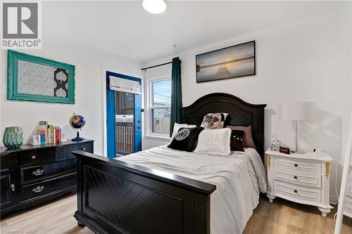 Bright room featuring wood-finish flooring and white walls - 34 Christopher Drive, Cambridge, ON - Indoor Photo Showing Bedroom
