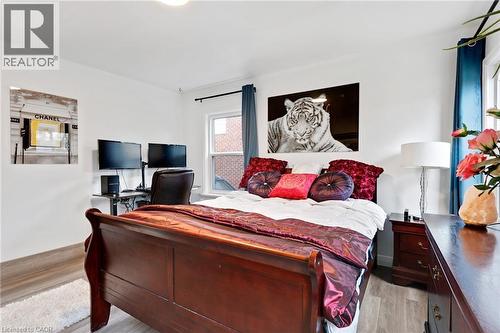 Spacious room featuring light wood-finish flooring and white walls - 34 Christopher Drive, Cambridge, ON - Indoor Photo Showing Bedroom