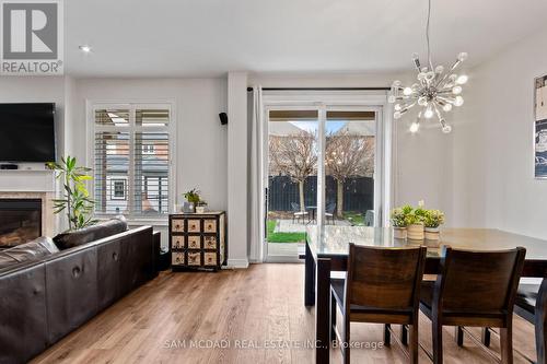 5142 Ancient Stone Avenue, Mississauga, ON - Indoor Photo Showing Dining Room With Fireplace