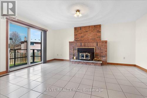 18 Marcel Place, Hamilton, ON - Indoor Photo Showing Living Room With Fireplace