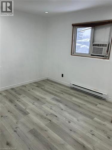 Room featuring light-toned wood-finish flooring, white baseboards, and white walls - 744 Parkview Crescent, Cambridge, ON - Indoor Photo Showing Other Room