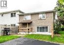 Brick exterior featuring a covered porch with wood railings - 744 Parkview Crescent, Cambridge, ON  - Outdoor 