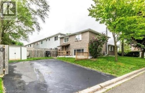 Paved driveway with adjacent green space and mature trees - 744 Parkview Crescent, Cambridge, ON - Outdoor