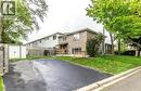 Paved driveway with adjacent green space and mature trees - 744 Parkview Crescent, Cambridge, ON  - Outdoor 