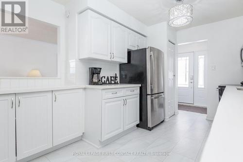 Fresh flooring and plenty of storage throughout. - 3 Oren Boulevard, Barrie, ON - Indoor Photo Showing Kitchen