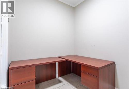 Dedicated office space featuring light-colored walls and tiled flooring - 833 King Street E, Hamilton, ON 
