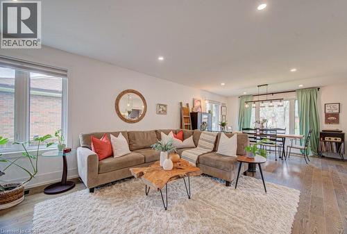 Open-concept living space featuring recessed lighting, wood-finish flooring, and ample natural light - 1486 Augustine Drive, Burlington, ON - Indoor Photo Showing Living Room