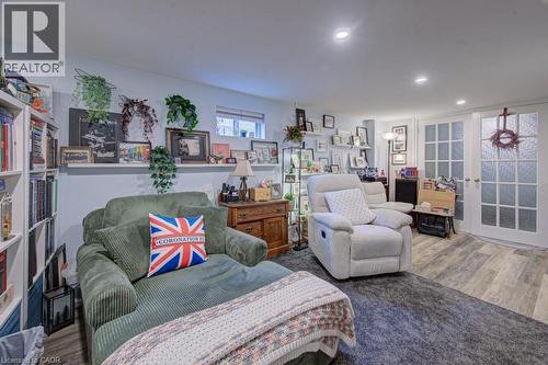 Spacious interior featuring wood-finish flooring, recessed lighting, and a neutral wall color - 1486 Augustine Drive, Burlington, ON - Indoor