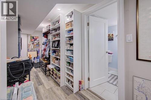 Hallway featuring wood-finish flooring and recessed lighting - 1486 Augustine Drive, Burlington, ON - Indoor