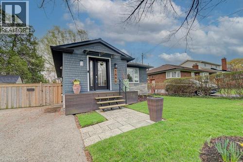Contemporary exterior with gray shingle siding and a black entry door - 1486 Augustine Drive, Burlington, ON - Outdoor