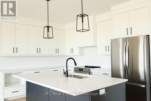74 Bedell Drive, Mapleton, ON - Indoor Photo Showing Kitchen With Double Sink With Upgraded Kitchen