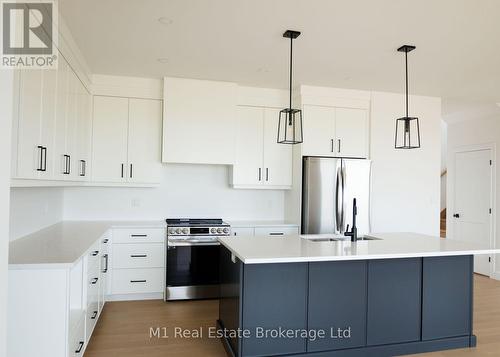 74 Bedell Drive, Mapleton, ON - Indoor Photo Showing Kitchen With Upgraded Kitchen