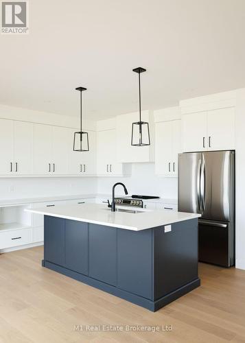 74 Bedell Drive, Mapleton, ON - Indoor Photo Showing Kitchen With Upgraded Kitchen