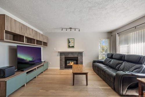 B-2425 1St St, Courtenay, BC - Indoor Photo Showing Living Room With Fireplace