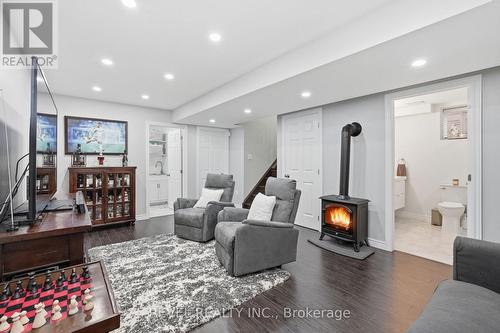 Finished Basement electric FP &  5-piece bathroom. - 109 Ray Street N, Hamilton, ON - Indoor Photo Showing Living Room With Fireplace