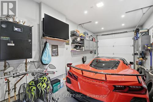 Temp Controlled, Roll Up door Door, Built Ins - 109 Ray Street N, Hamilton, ON - Indoor Photo Showing Garage