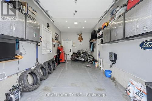 Temp Controlled, Roll Up door Door, Built Ins - 109 Ray Street N, Hamilton, ON - Indoor Photo Showing Garage