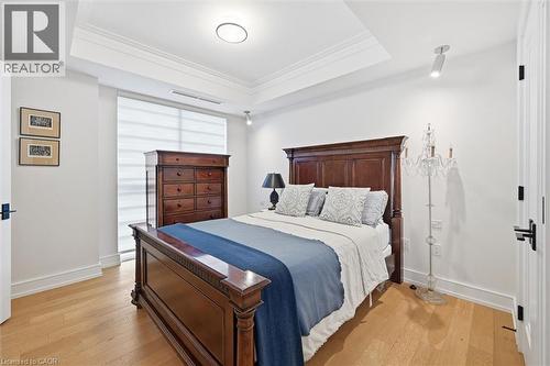 Recessed ceiling with crown molding and central lighting fixture - 2060 Lakeshore Road Unit# 1501, Burlington, ON - Indoor Photo Showing Bedroom