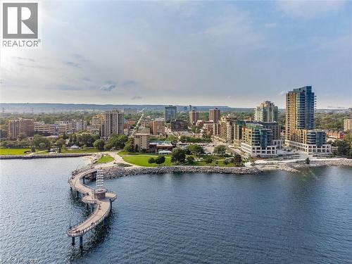 Aerial perspective showcasing a vibrant waterfront community - 2060 Lakeshore Road Unit# 1501, Burlington, ON - Outdoor With Body Of Water With View