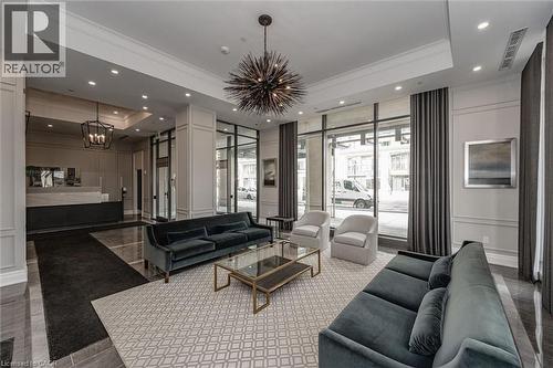 Lobby reception area featuring a high ceiling, recessed lighting, and large storefront windows - 2060 Lakeshore Road Unit# 1501, Burlington, ON - Indoor