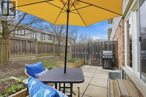 With patio, gardens, and privacy - 42 Fallowfield Drive Unit# 15, Kitchener, ON - Outdoor With Deck Patio Veranda With Exterior