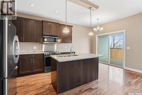 111 115 Shepherd Crescent, Saskatoon, SK - Indoor Photo Showing Kitchen With Stainless Steel Kitchen With Double Sink With Upgraded Kitchen