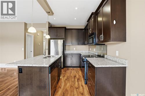 111 115 Shepherd Crescent, Saskatoon, SK - Indoor Photo Showing Kitchen With Stainless Steel Kitchen With Upgraded Kitchen