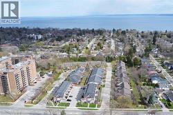 Aerial perspective showcasing a residential area with a prominent body of water in the background - 