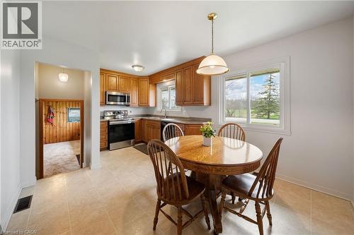 Kitchen area with light tone tile flooring - 2223 Hall Road, Binbrook, ON - Indoor Photo Showing Dining Room