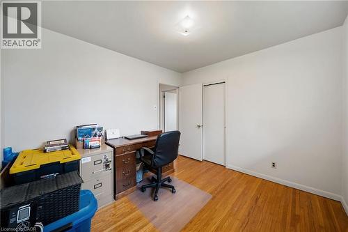 Room with warm wood-finish flooring, white walls, and a flush-mount ceiling light - 2223 Hall Road, Binbrook, ON - Indoor Photo Showing Office