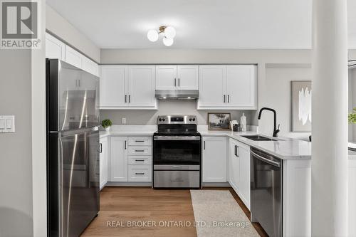 7048 Frontier Ridge, Mississauga, ON - Indoor Photo Showing Kitchen With Stainless Steel Kitchen With Double Sink