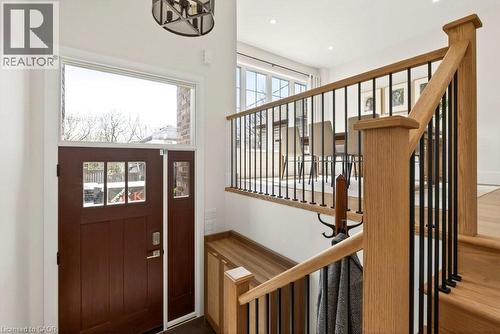 Entryway featuring a wood-panel door with glass inserts, a transom window, and a sidelight - 128 Canada Street, Hamilton, ON - Indoor Photo Showing Other Room