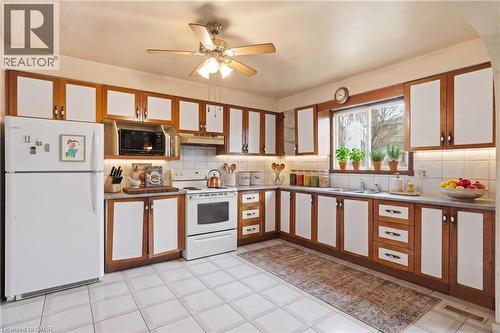 Virtually Staged - 60 Rexford Drive, Hamilton, ON - Indoor Photo Showing Kitchen With Double Sink