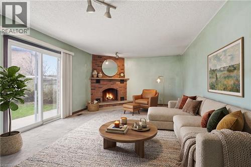 Virtually Staged - 60 Rexford Drive, Hamilton, ON - Indoor Photo Showing Living Room With Fireplace