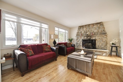 Living Room - 5375 Boul. Des Mille-Îles, Laval (Saint-François), QC - Indoor Photo Showing Living Room With Fireplace