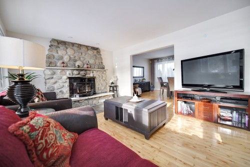 Living Room - 5375 Boul. Des Mille-Îles, Laval (Saint-François), QC - Indoor Photo Showing Living Room With Fireplace