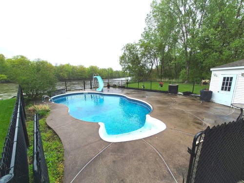 Waterfront - 5375 Boul. Des Mille-Îles, Laval (Saint-François), QC - Outdoor With In Ground Pool With Backyard