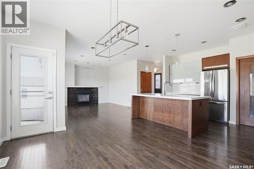 446 Pichler Crescent, Saskatoon, SK - Indoor Photo Showing Kitchen With Fireplace