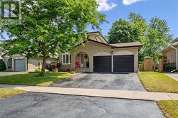 Brick exterior with arched entry and two-car garage - 