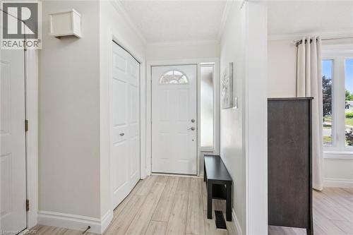 Entryway featuring light wood-finish flooring, white trim, and a frosted sidelight - 97 Bechtel Drive, Kitchener, ON - Indoor Photo Showing Other Room