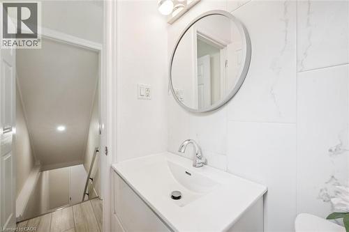 Modern vanity with an integrated sink and chrome faucet - 97 Bechtel Drive, Kitchener, ON - Indoor Photo Showing Bathroom