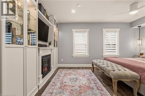 14 Mars Avenue, Hamilton, ON - Indoor Photo Showing Bedroom With Fireplace