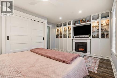 14 Mars Avenue, Hamilton, ON - Indoor Photo Showing Bedroom With Fireplace