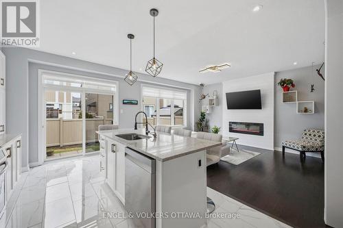 139 Switch Grass Crescent, Ottawa, ON - Indoor Photo Showing Kitchen With Fireplace With Upgraded Kitchen
