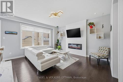 139 Switch Grass Crescent, Ottawa, ON - Indoor Photo Showing Living Room With Fireplace